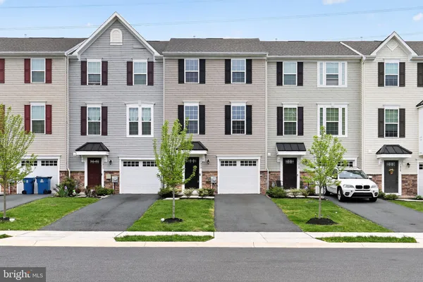 a view of multiple houses with a yard