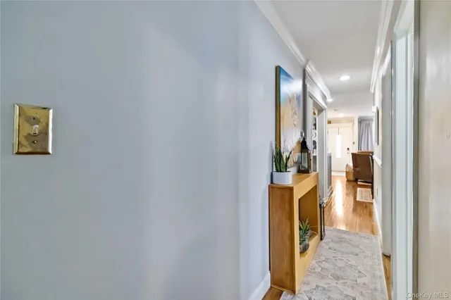 a view of a hallway with a living room