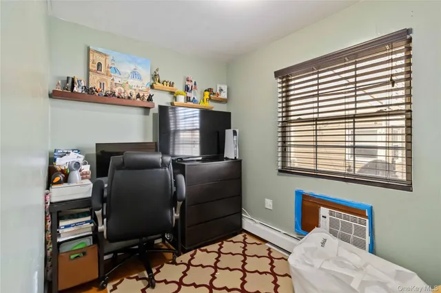a bedroom with furniture and a window