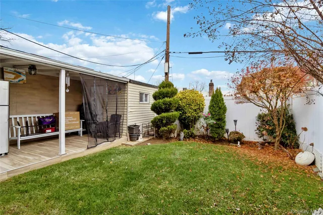 a view of a chairs and table in front of a house
