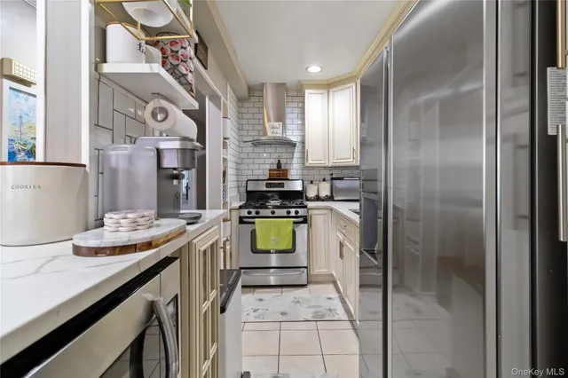a kitchen with a sink stove and refrigerator