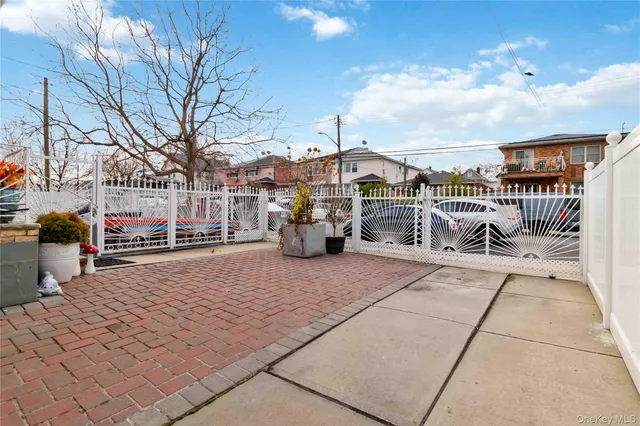a outdoor view with a barbeque oven and a fountain