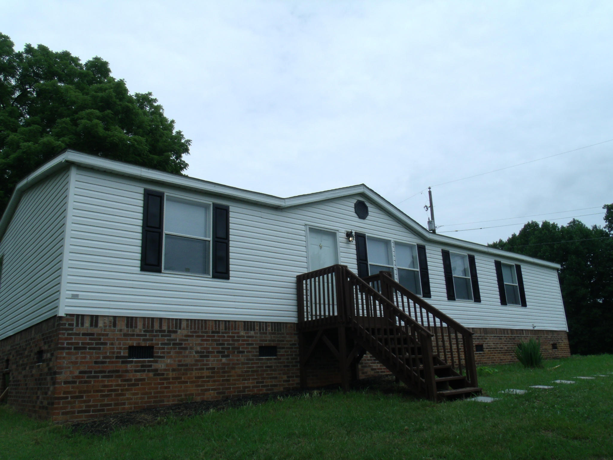 1008 Black Jack Road Stuart, VA 24171 - Photo 3 of 14 a view of a house with a yard