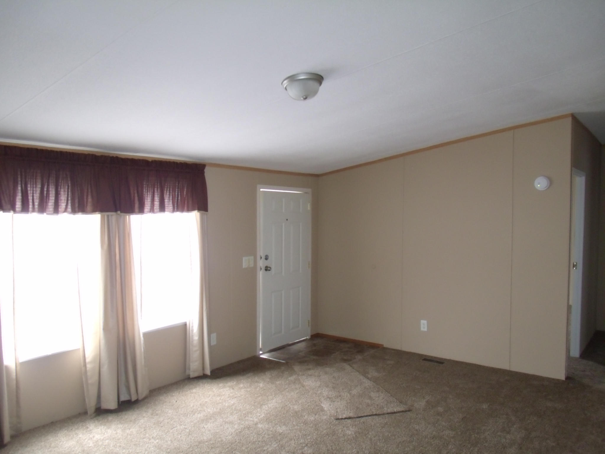 1008 Black Jack Road Stuart, VA 24171 - Photo 5 of 14 a view of an empty room and a window