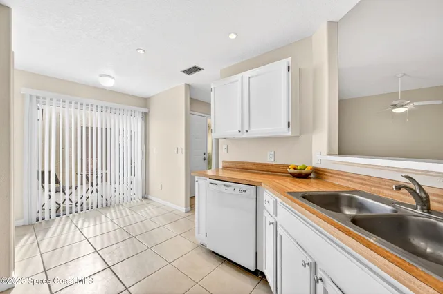 a kitchen with a sink cabinets and utility