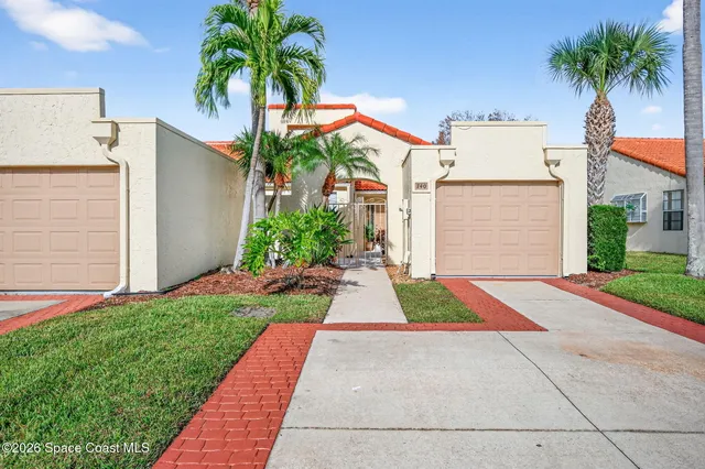 a small garden in the corner of a house