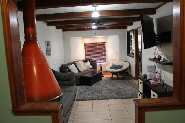 a living room with furniture and a rug