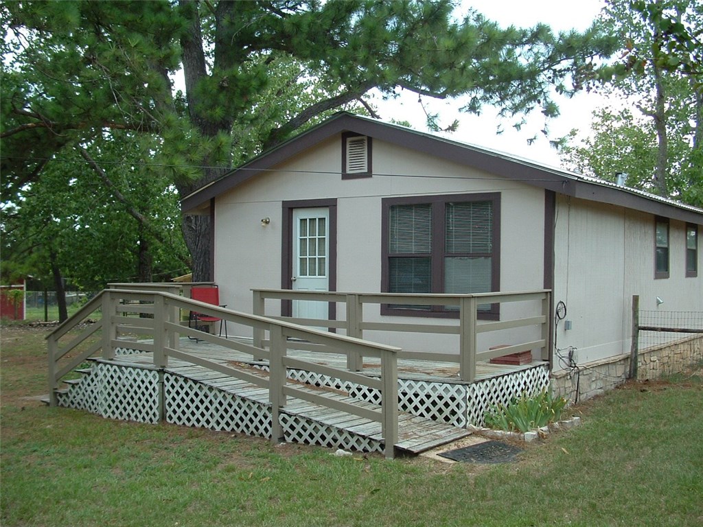 162 4 C Ranch Road Bastrop, TX 78602 - Photo 1 of 1 Front of home. No, this is not a manufactured home.
