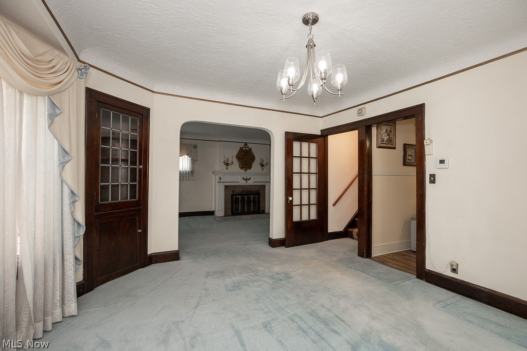 3571 Harvey Road Cleveland, OH 44118 - Photo 5 of 40 Dining room with a wealth of natural light, carpet flooring, ornamental molding, and radiator