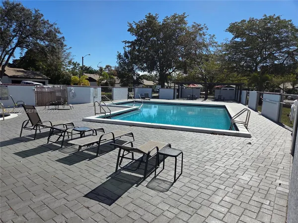 a view of a chairs and tables in the patio