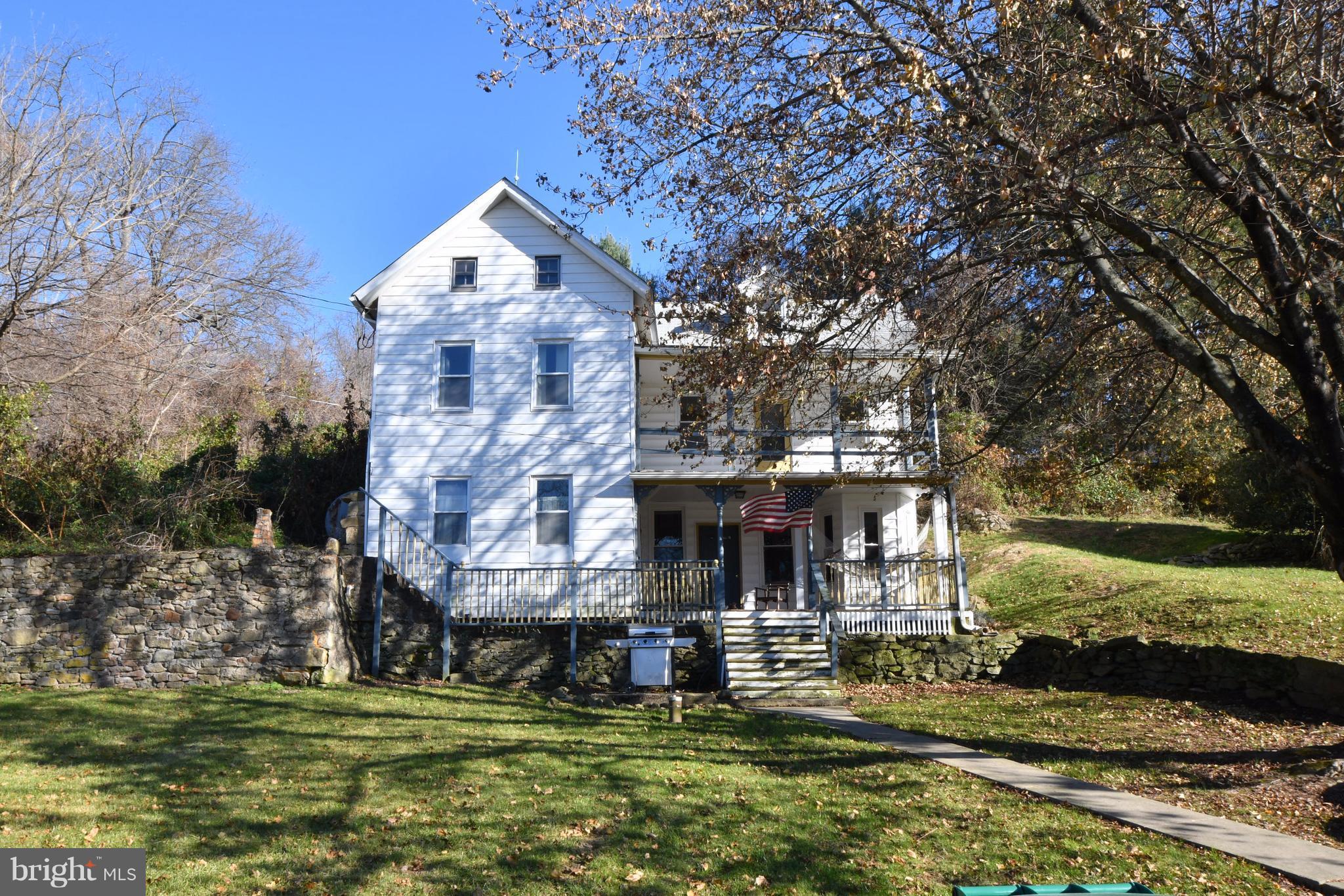 1095 Colora Road Colora, MD 21917 - Photo 1 of 29 a front view of a house with a garden and trees