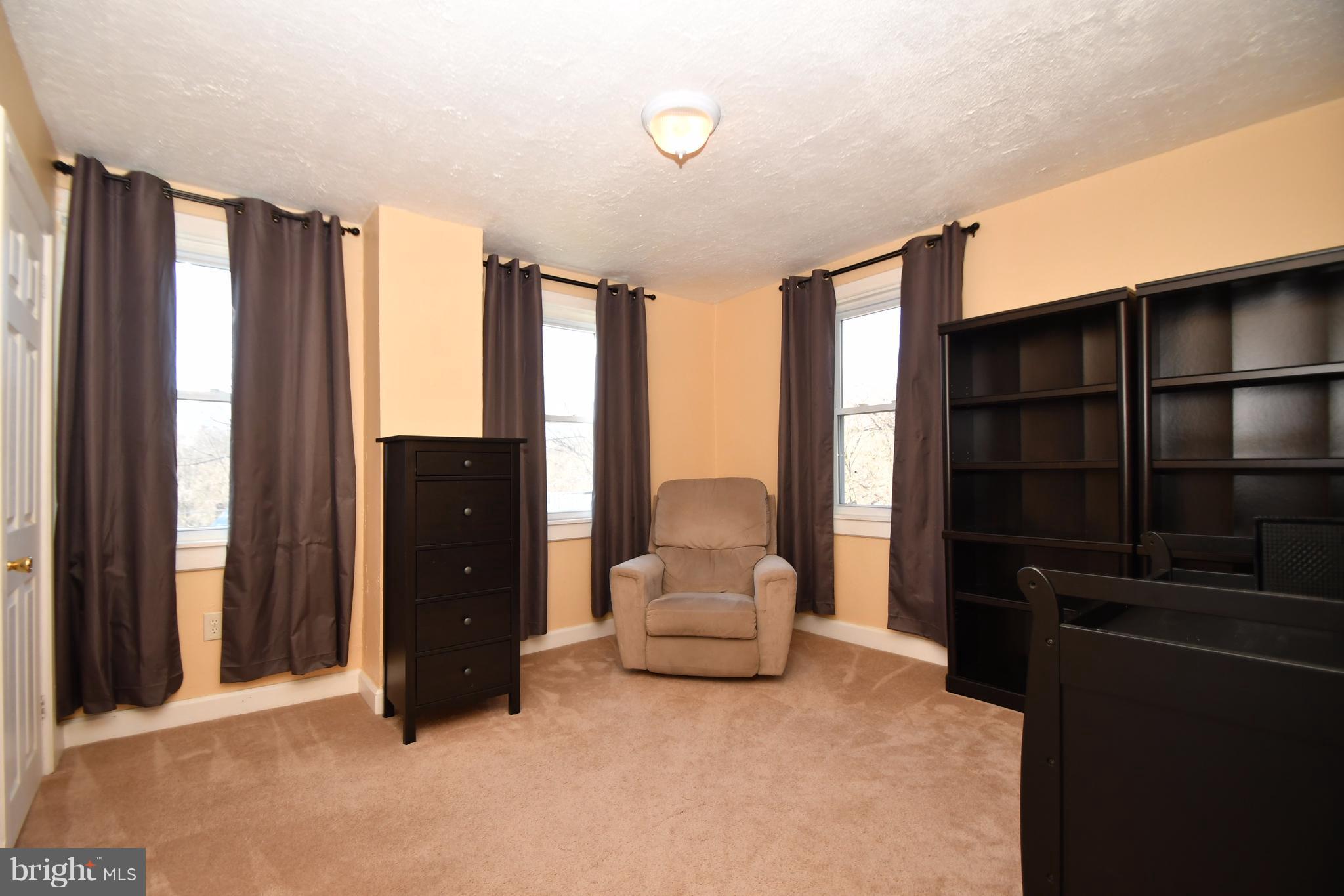 1095 Colora Road Colora, MD 21917 - Photo 15 of 29 a living room with furniture a large window and walk in closet