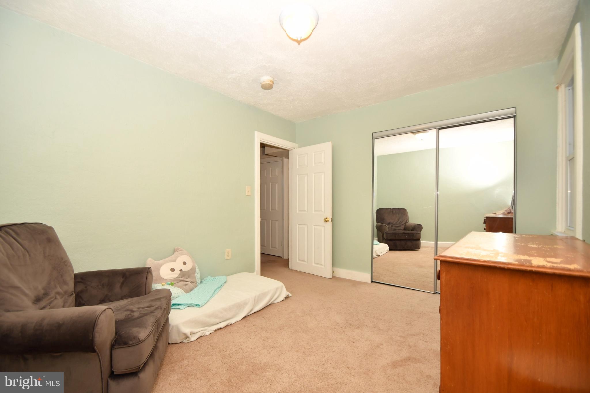 1095 Colora Road Colora, MD 21917 - Photo 18 of 29 a living room with furniture and a floor to ceiling window