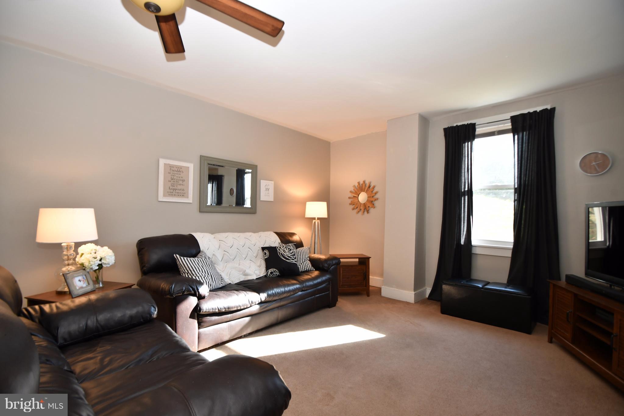 1095 Colora Road Colora, MD 21917 - Photo 3 of 29 a living room with furniture and a flat screen tv