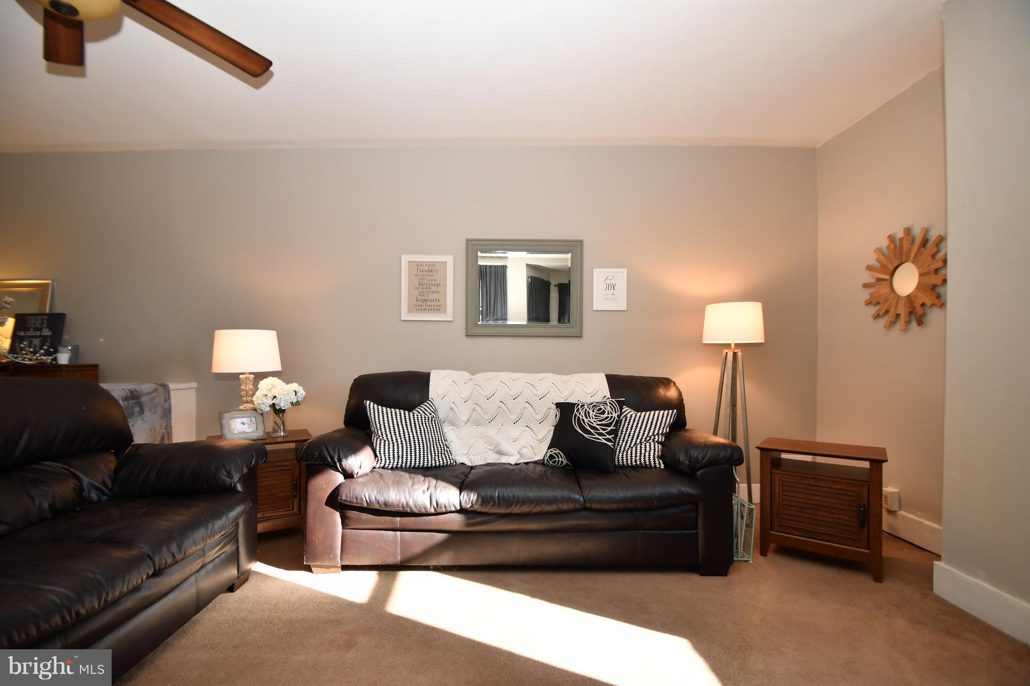 1095 Colora Road Colora, MD 21917 - Photo 4 of 29 a living room with furniture and a lamp