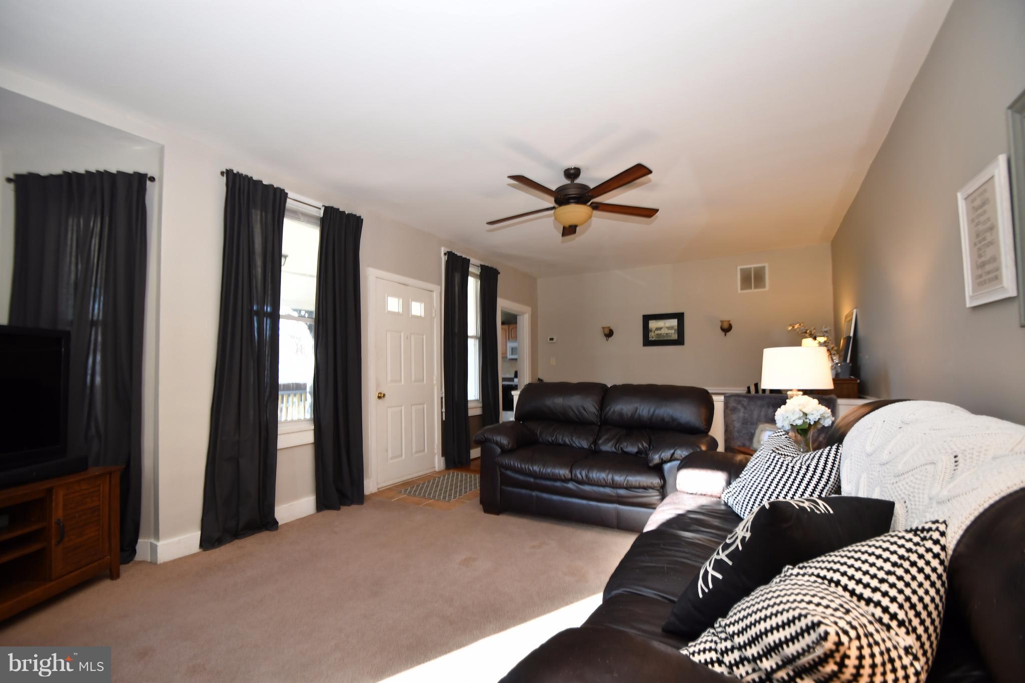 1095 Colora Road Colora, MD 21917 - Photo 5 of 29 a living room with furniture ceiling fan and a window