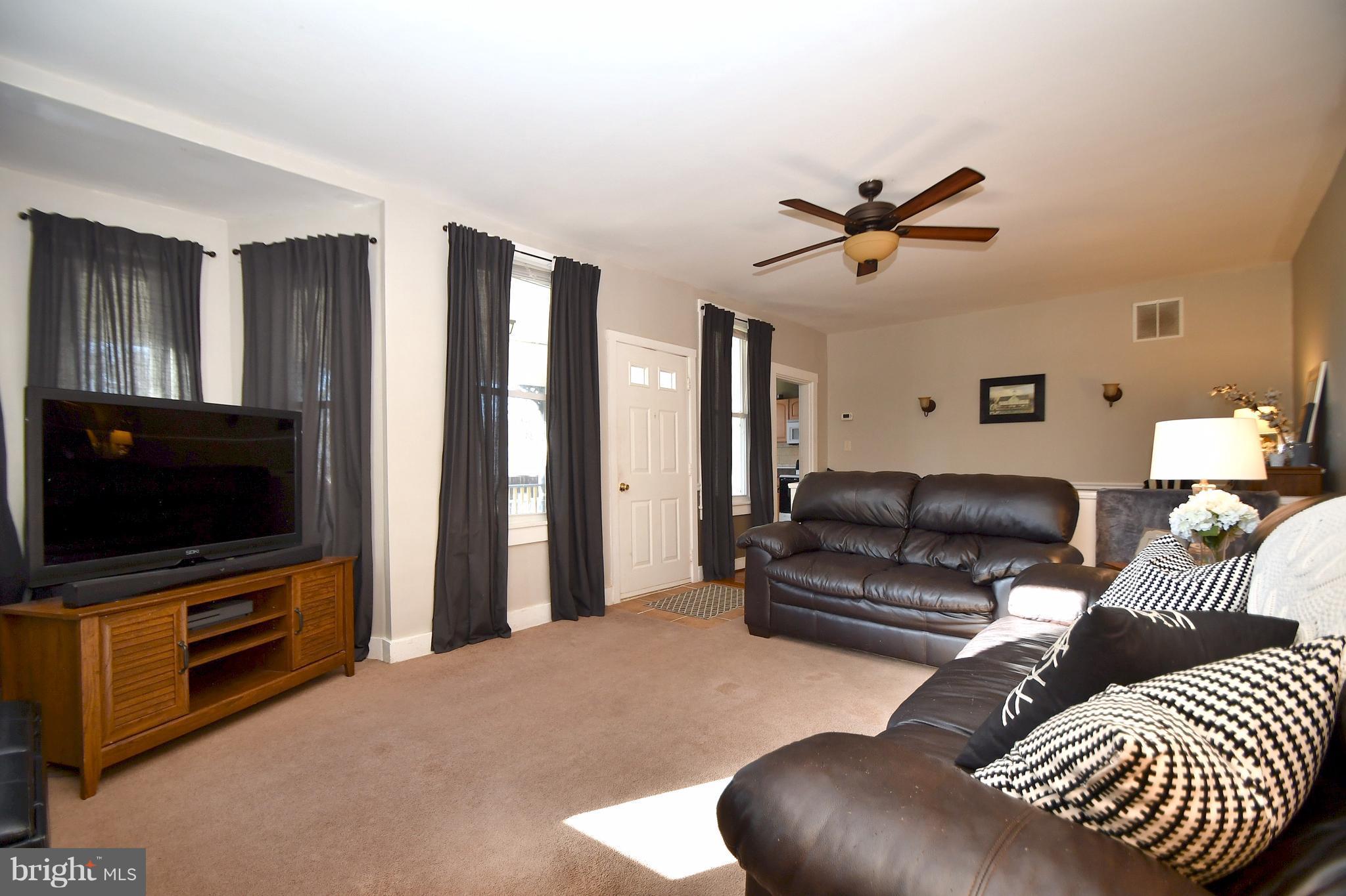1095 Colora Road Colora, MD 21917 - Photo 6 of 29 a living room with furniture and a flat screen tv