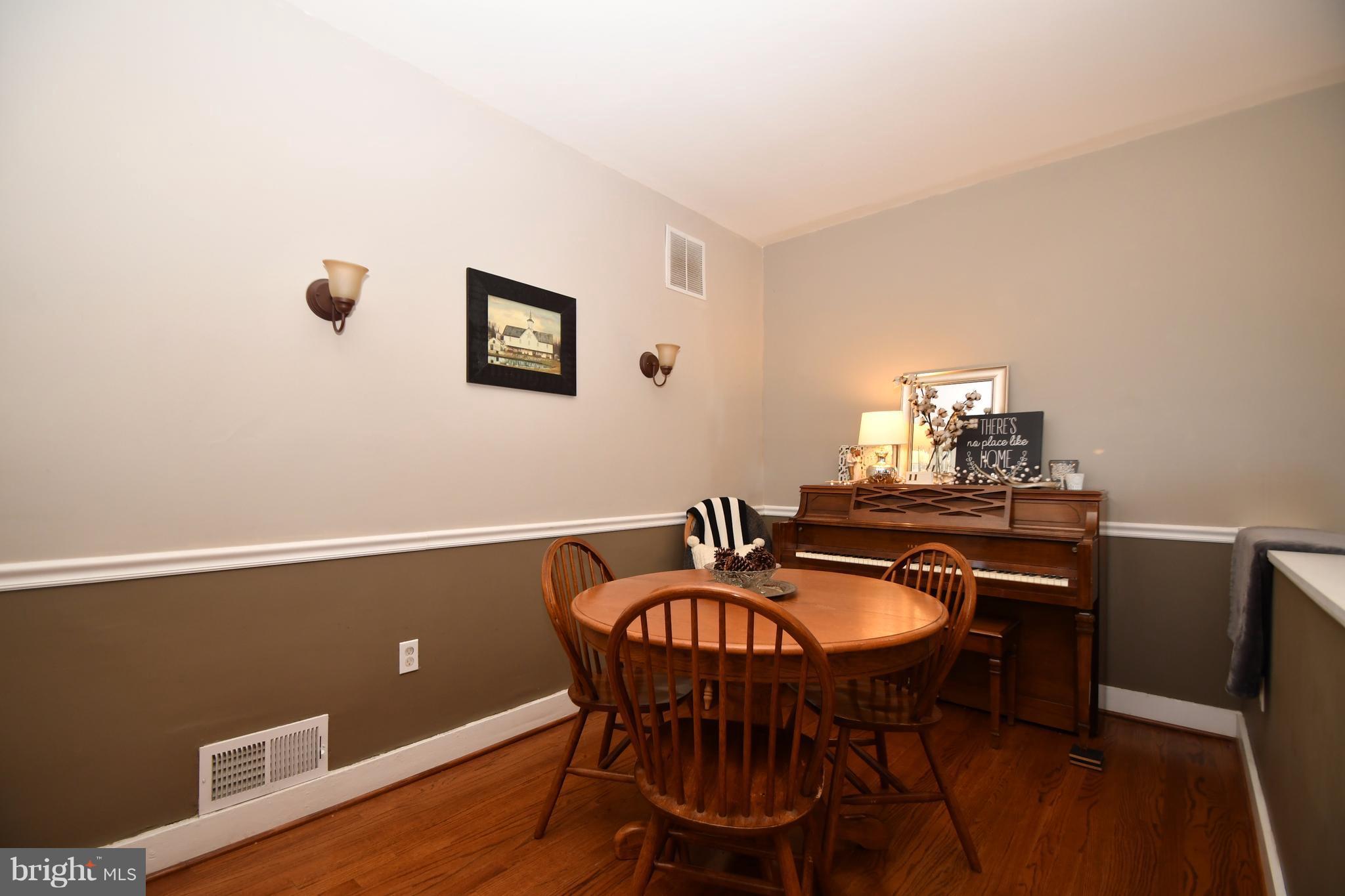 1095 Colora Road Colora, MD 21917 - Photo 7 of 29 a view of a dining room with furniture and wooden floor