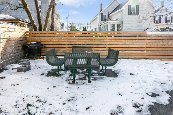 a view of a lounge chairs in the back yard