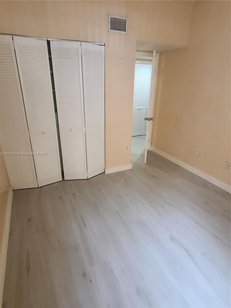 8807 Southwest 130th Place, Unit 102 Miami, FL 33186 - Photo 14 of 18 a view of an empty room