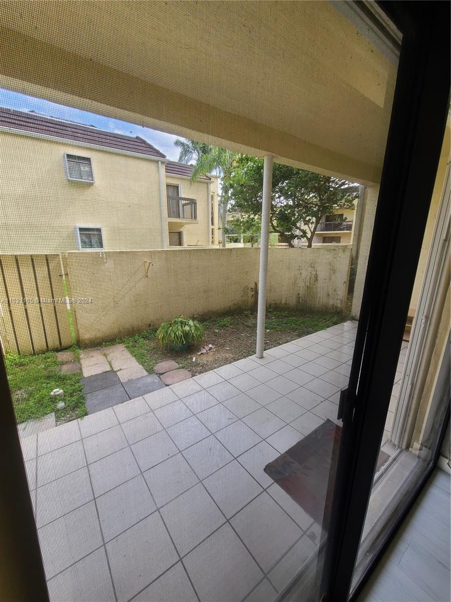 8807 Southwest 130th Place, Unit 102 Miami, FL 33186 - Photo 18 of 18 a view of a porch