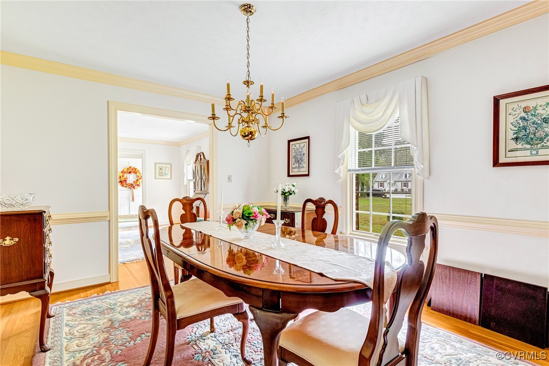 2530 Yarnell Road Henrico, VA 23231 - Photo 10 of 22 a view of a dining room with furniture window and wooden floor