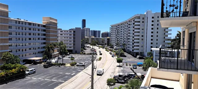 a kitchen with stainless steel appliances a stove microwave and sink