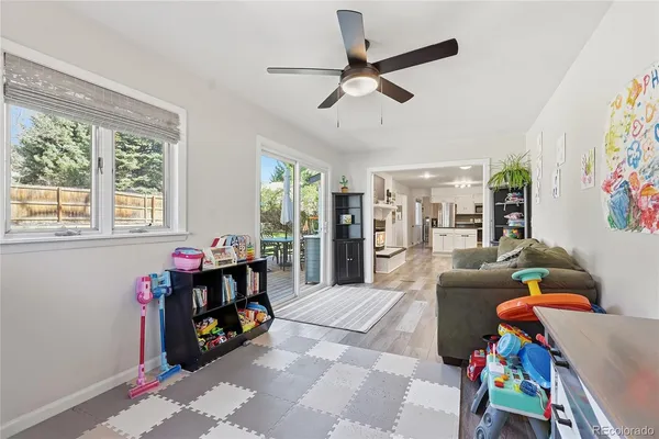 a living room with furniture and a window