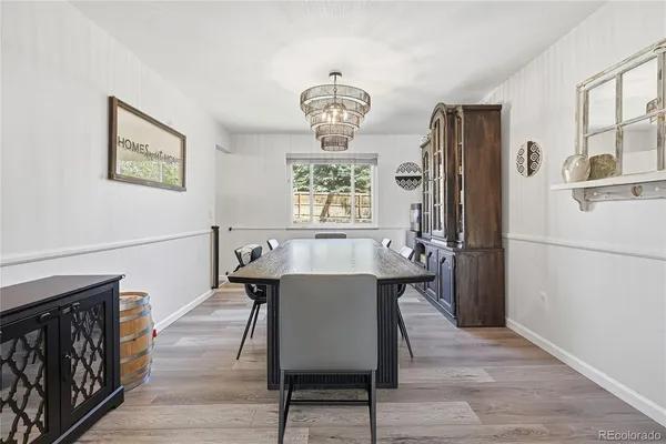 a view of a dining room with furniture window and wooden floor