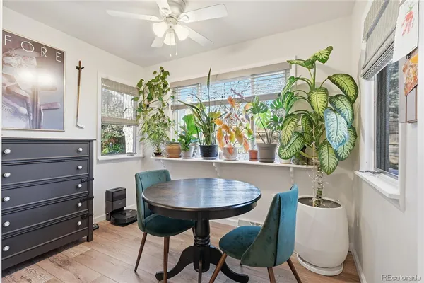 a dining room with furniture and window