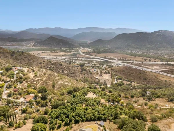 a view of a town with mountains in the background