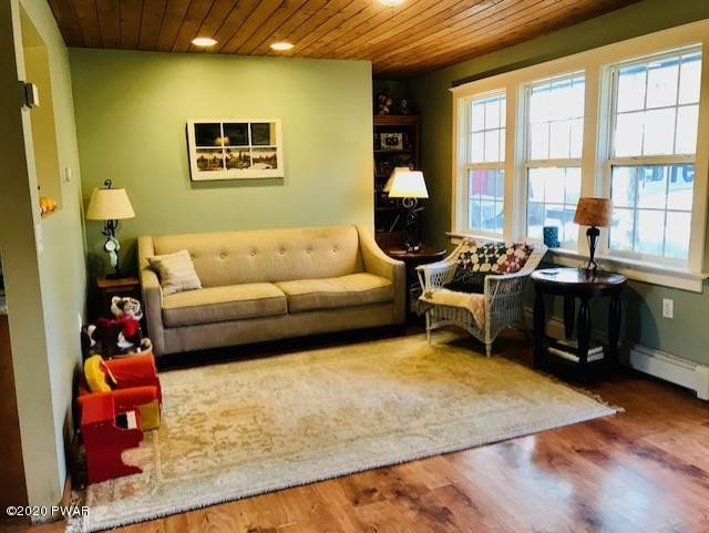 798 Goose Pond Road Lake Ariel, PA 18436 - Photo 18 of 47 a living room with furniture and a floor to ceiling window