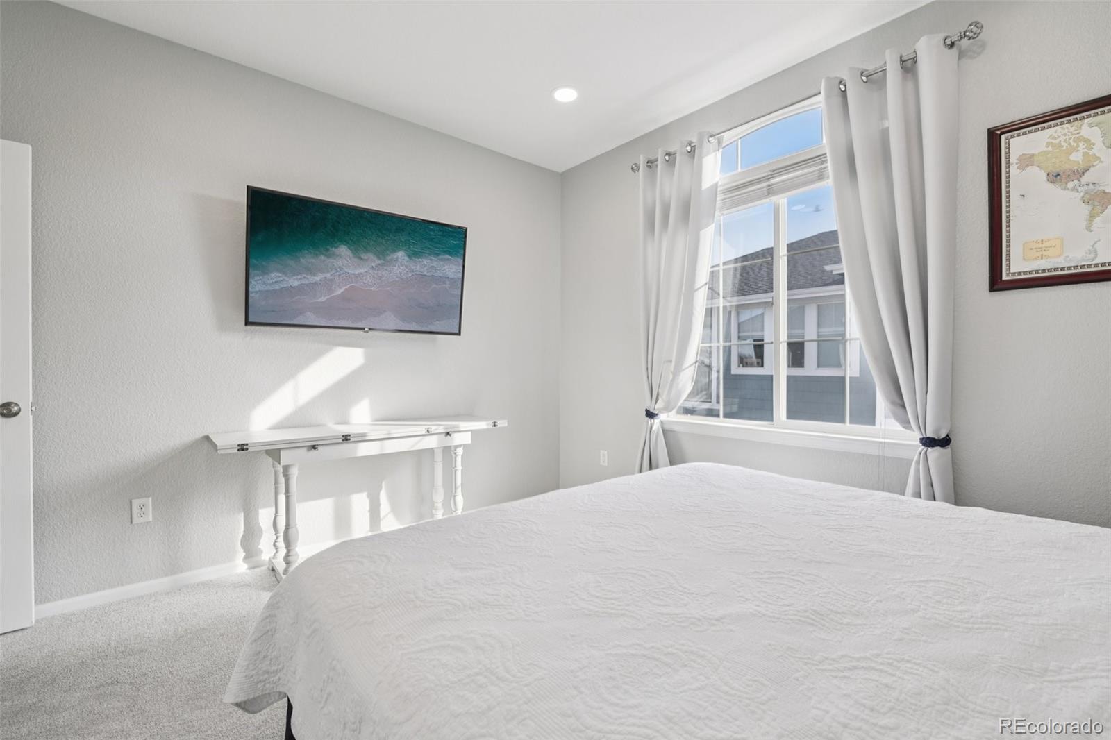 224 Whitehaven Circle Highlands Ranch, CO 80129 - Photo 11 of 34 a bedroom with a bed and a window