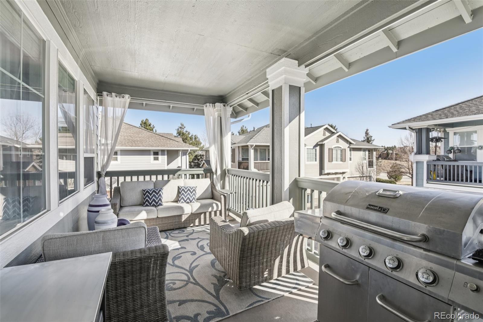 224 Whitehaven Circle Highlands Ranch, CO 80129 - Photo 26 of 34 a living room with furniture and a large window