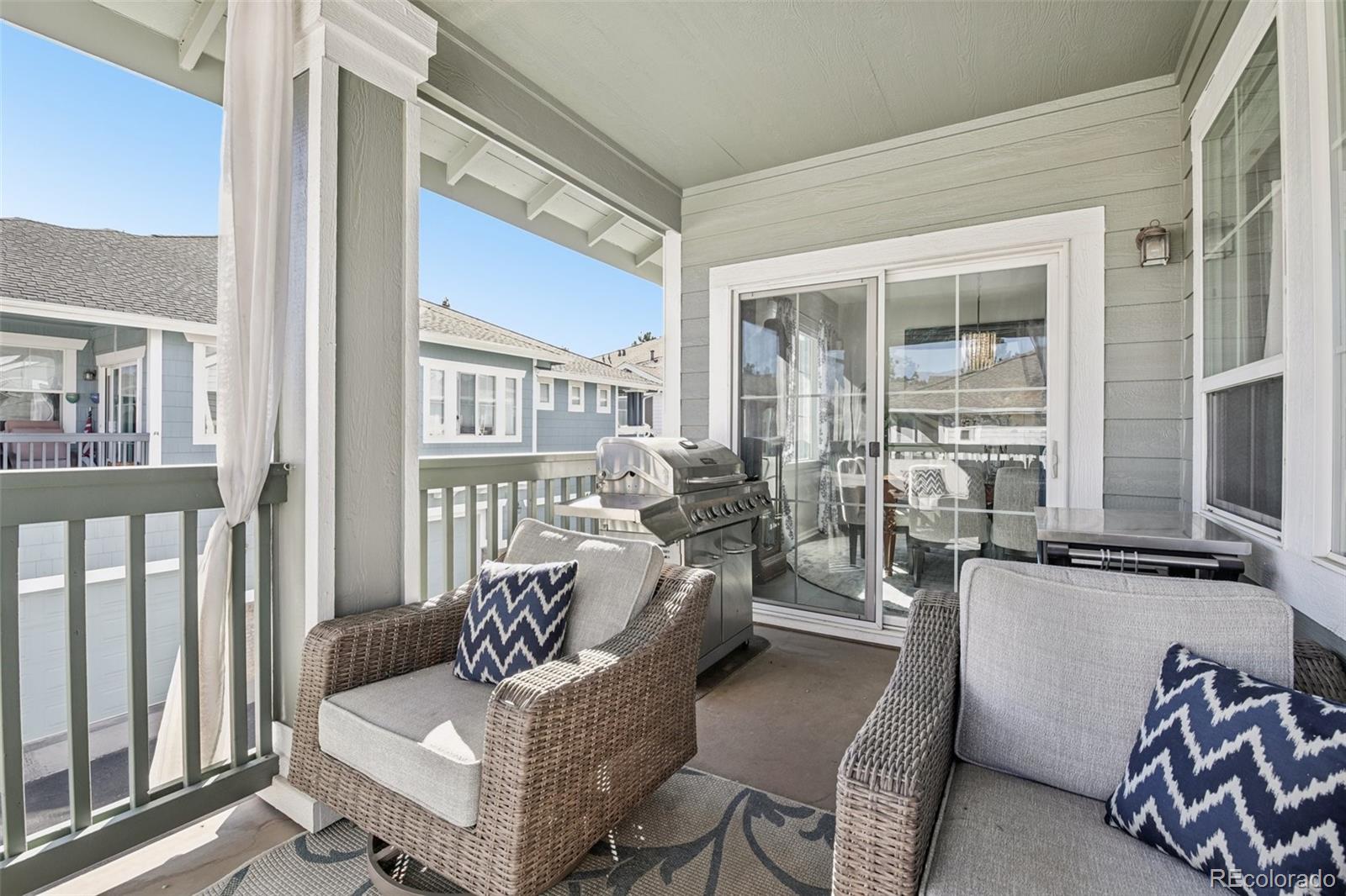 224 Whitehaven Circle Highlands Ranch, CO 80129 - Photo 27 of 34 a living room with furniture and a flat screen tv