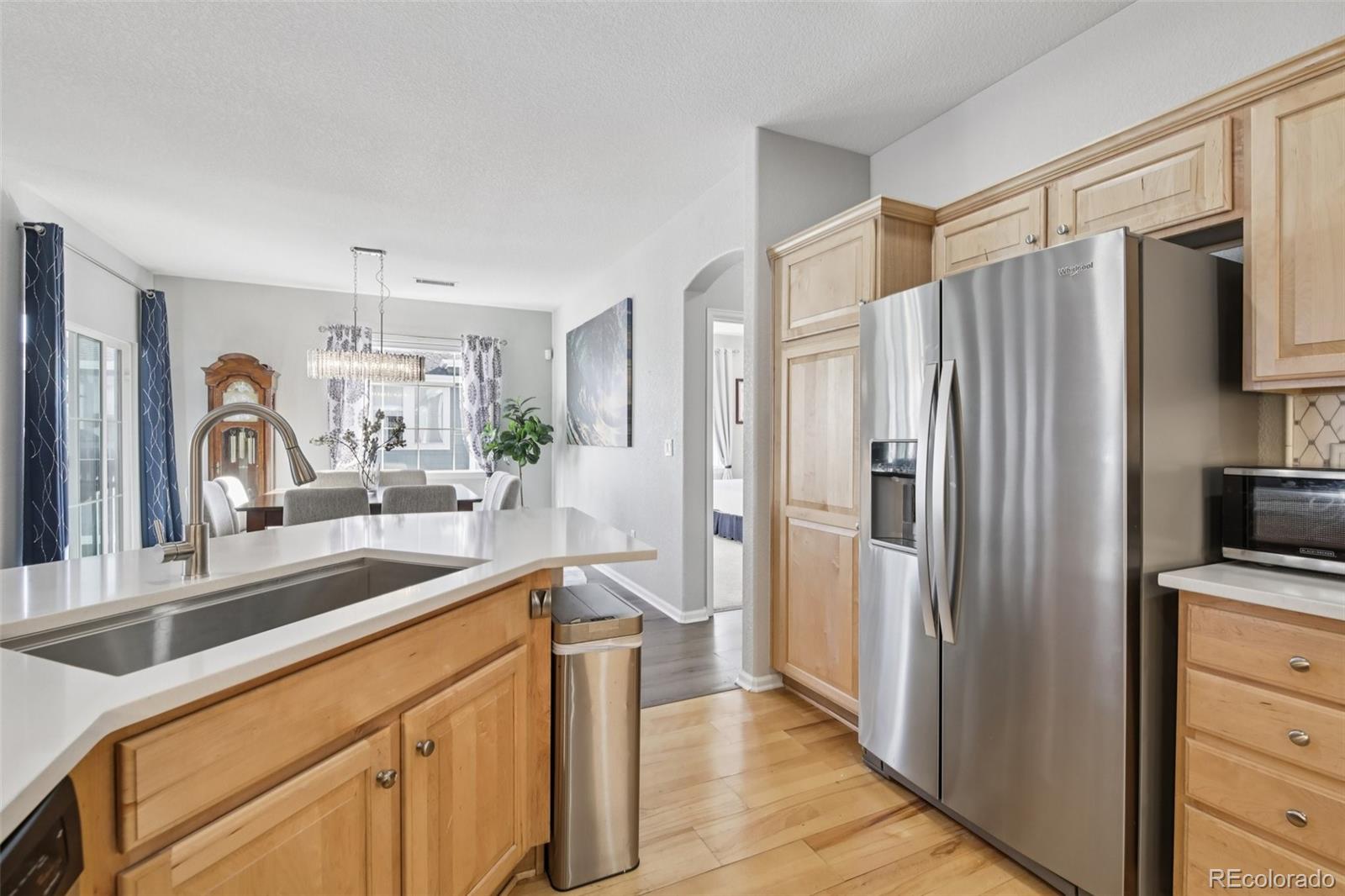 224 Whitehaven Circle Highlands Ranch, CO 80129 - Photo 7 of 34 a kitchen with a refrigerator and a sink