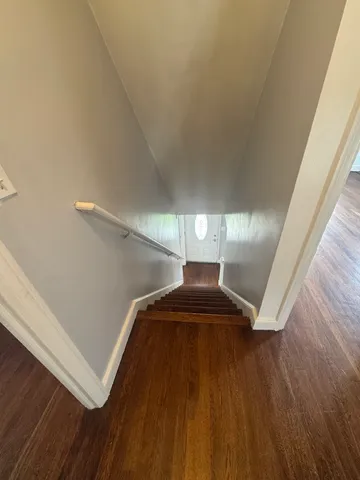 a view of a room with wooden walls