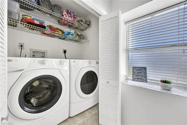 a utility room with dryer and washer