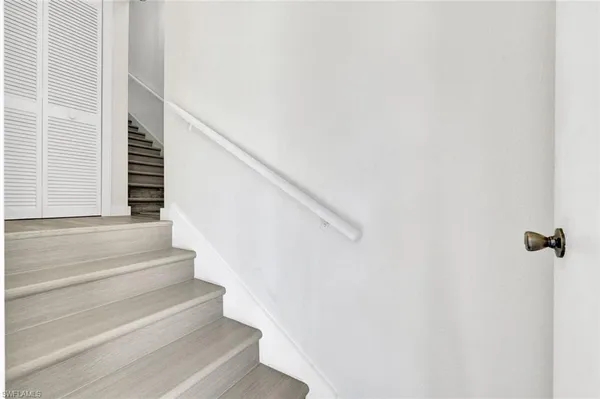 a view of staircase with white walls and white walls