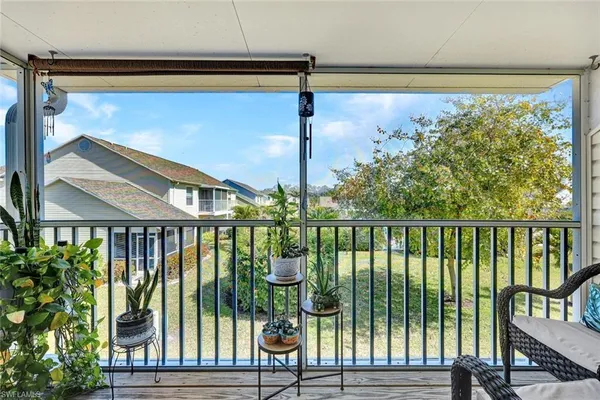 a view of a two chairs in the balcony