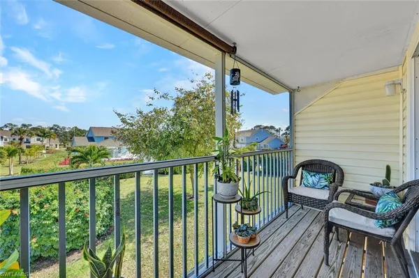 a view of a swimming pool and a chairs