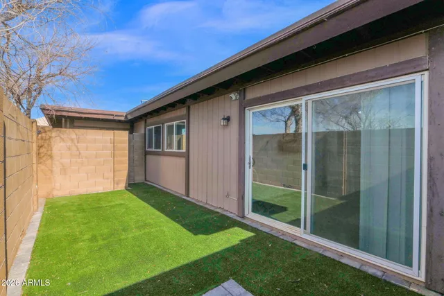 a backyard of a house with seating space