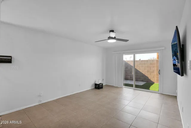 a room with window and a ceiling fan