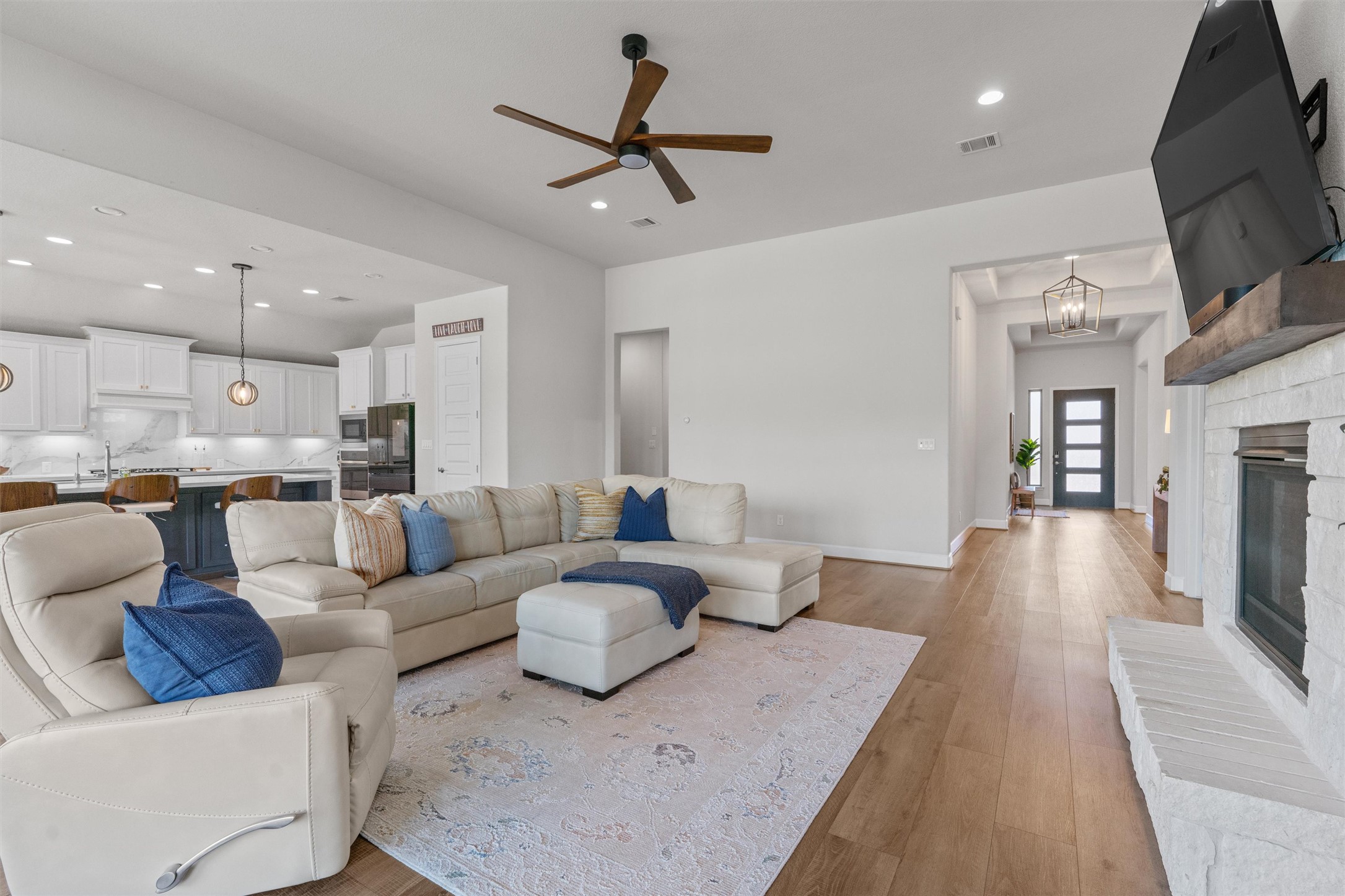 101 Pienza Drive Georgetown, TX 78628 - Photo 13 of 40 a living room with furniture and a wooden floor