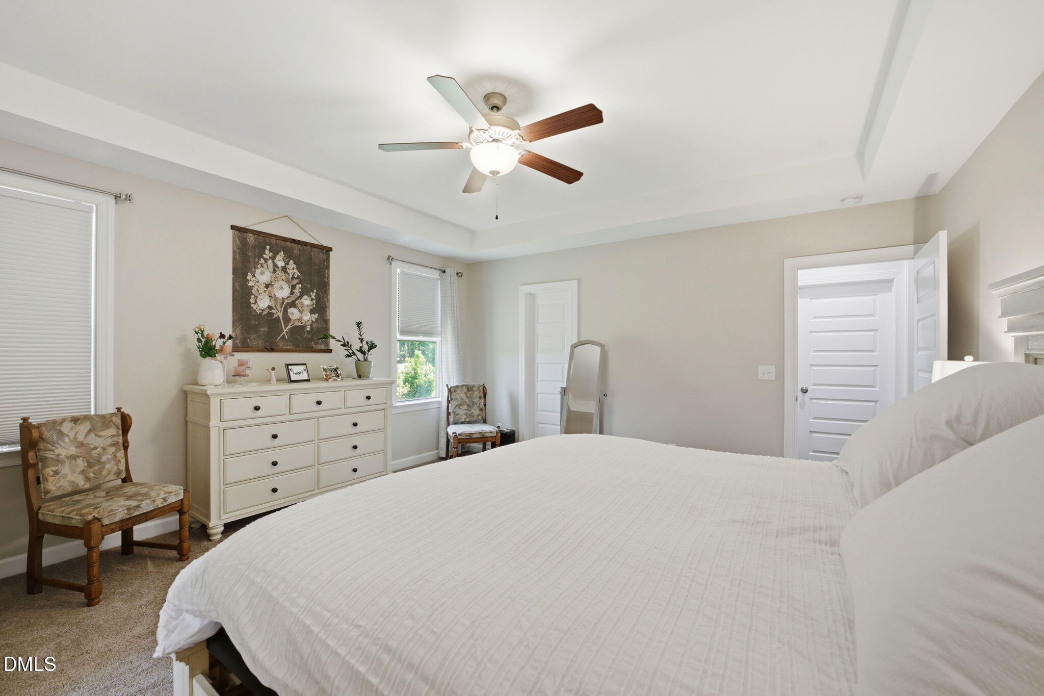 1547 Lassiter Pond Road Four Oaks, NC 27524 - Photo 21 of 45 a bedroom with a bed a dresser and a window