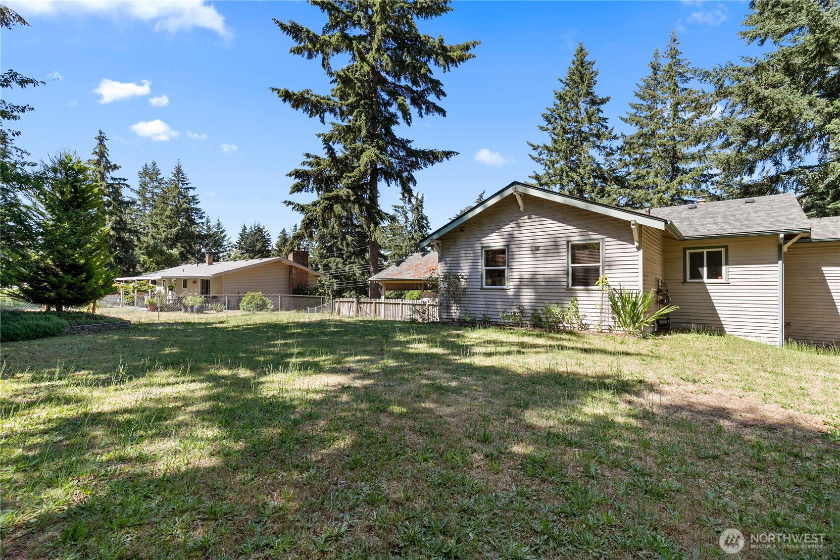 9880 Fredrickson Road Northwest Bremerton, WA 98311 - Photo 25 of 28 a front view of house with yard and green space