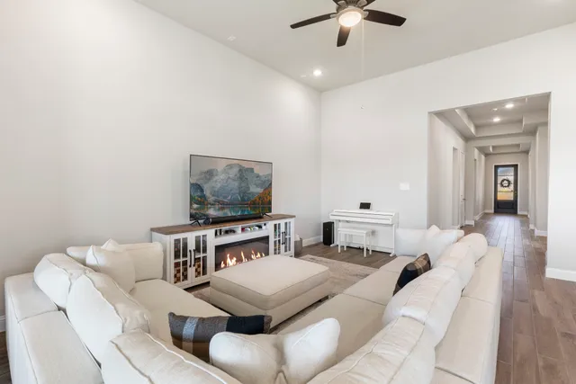 a living room with furniture and a flat screen tv