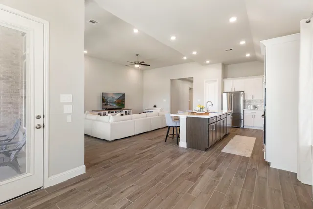 a view of kitchen with counter top space a sink stainless steel appliances and cabinets
