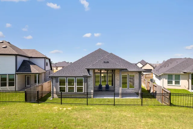 a view of a house with swimming pool and a yard