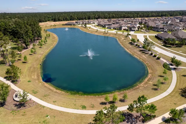 an aerial view of a house with a swimming pool